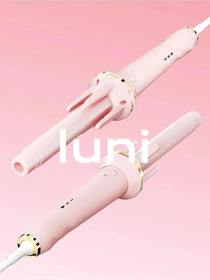 Pink hair curler with 'luni' branding on a pink background