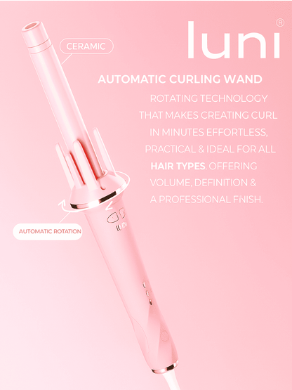 Pink curling wand with text on a pink background